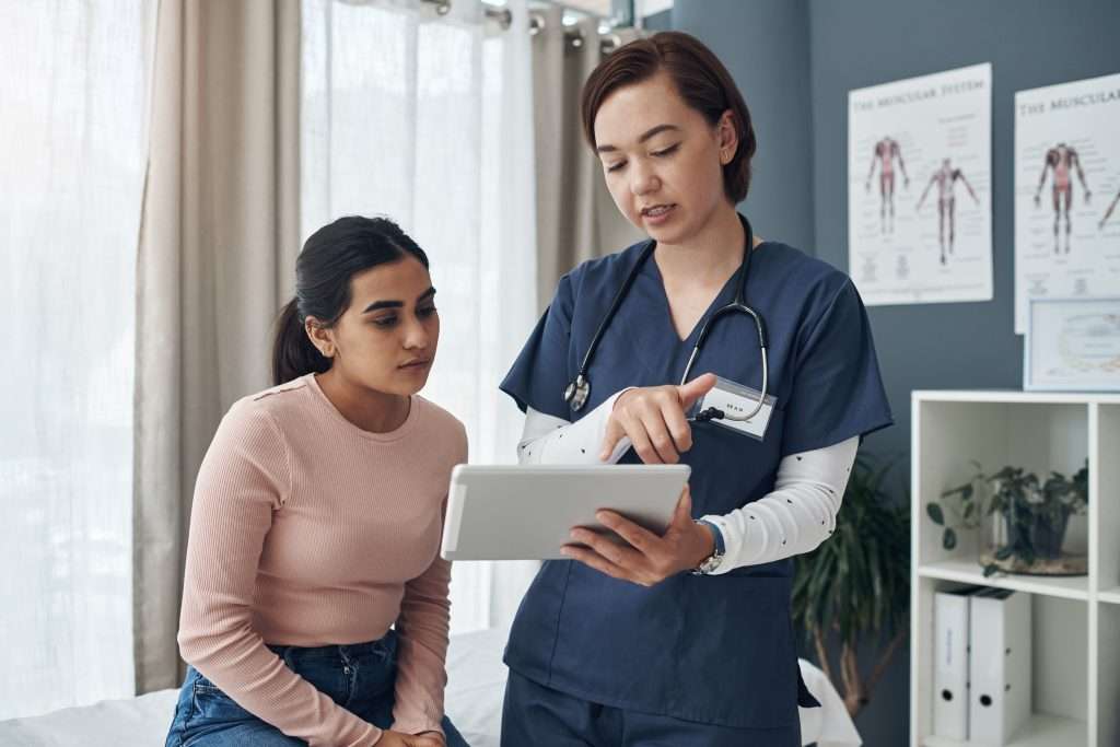 Doctor consults with patient